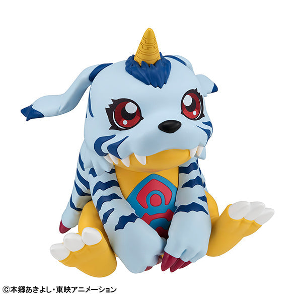 A physical figure  on a white background of the Digimon Gabumon,  a yellow dinosaur beast wearing a white and blue striped pelt over it's body, and a yellow horn from it's head.